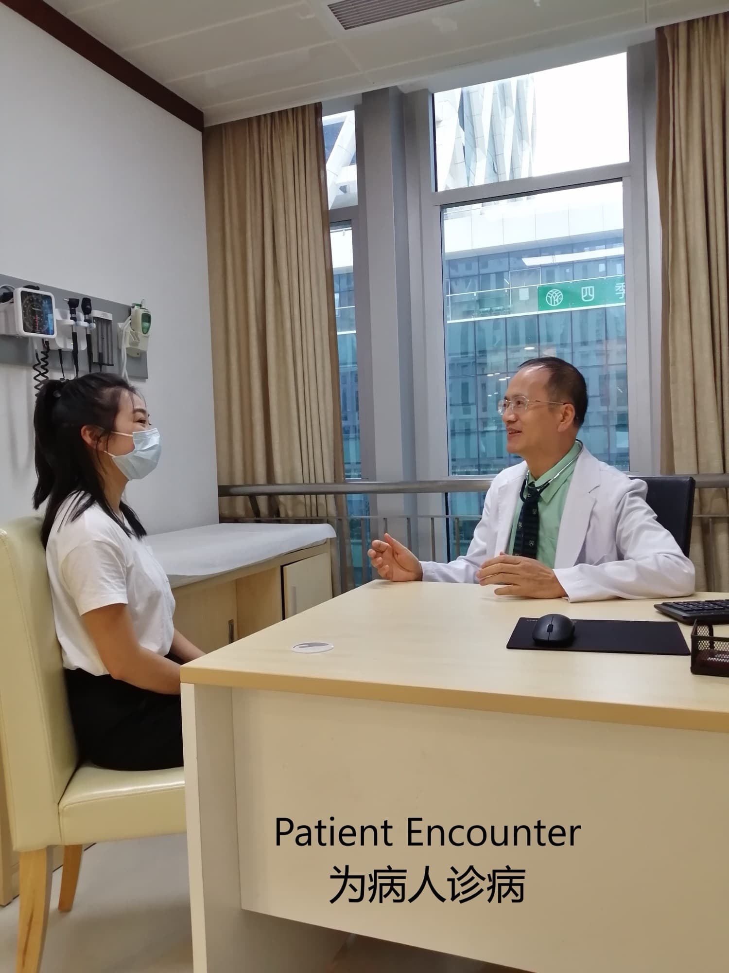 Dr. Lee in a white coat consulting a masked young patient in an exam room